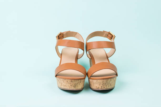 istock Women's summer leather sandals on a blue background. The view from the top. 1251232800