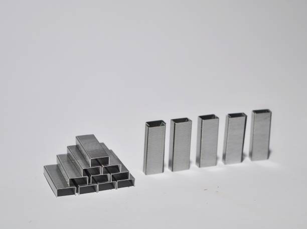 istock Pile of staples/stapler isolated on white background 1251238462
