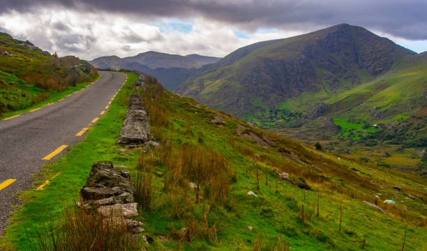 istock Narrow Road by an Irish Valley 1251241532