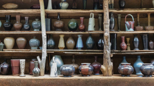 istock Handcraft ceramic kitchenwares molded arranged on shelve 1251248099