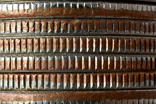 A close macro image of six (6) stacked US quarters.