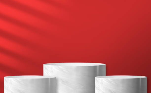 istock marble cylinder podium product display at red background and sunlight 1251251618