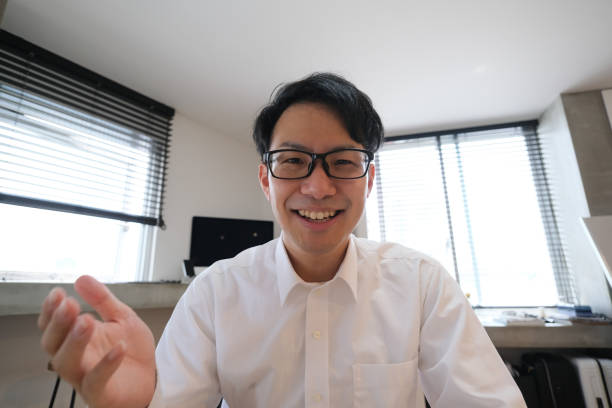 istock Asian businessman talking on video conference from home 1251259622