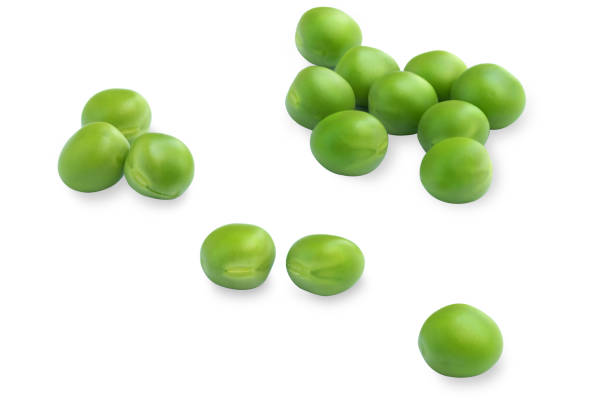istock Fresh green peas on a white background, top view 1251260296