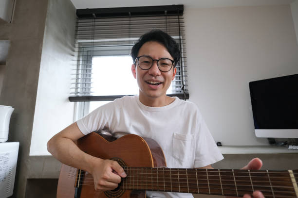 istock Asian youtuber broadcasting from home 1251260312