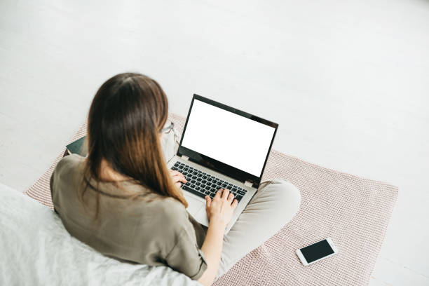 istock Girl uses laptop mockup. 1251260845
