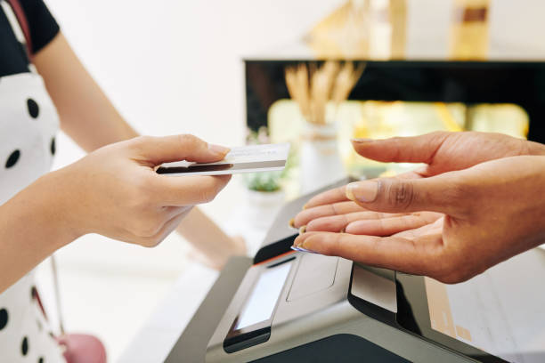 istock Customer paying with credit card 1251261433
