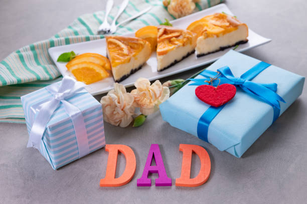 istock Orange cheese cakes and gift boxes, happy father's day concept 1251264734