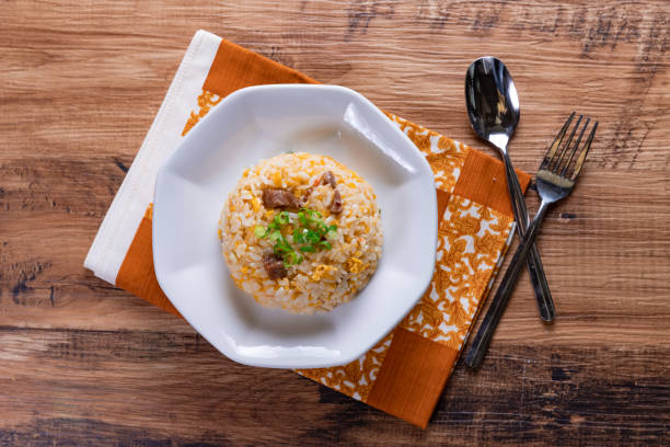 Fried Rice, Chinese Fried rice with some ingredients such as eggs, vegetables, and meat. rice bowl restaurant stock pictures, royalty-free photos & images
