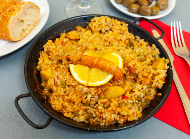 istock Paella marinera with lemon on iron frypan 1251265520