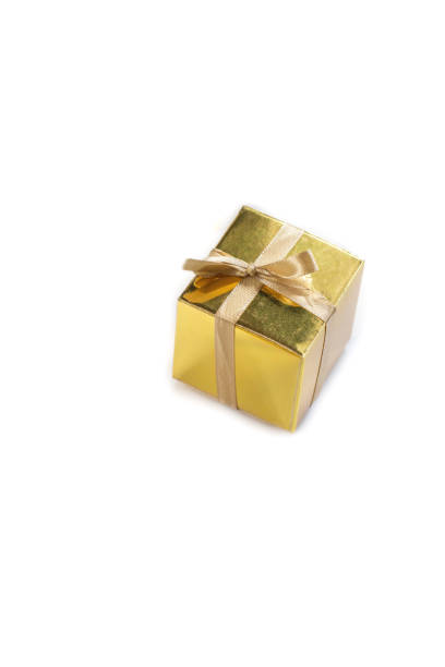istock Beautiful sparkling golden gift box isolated on white background, present or surprise with beautiful bow space for text 1251265569