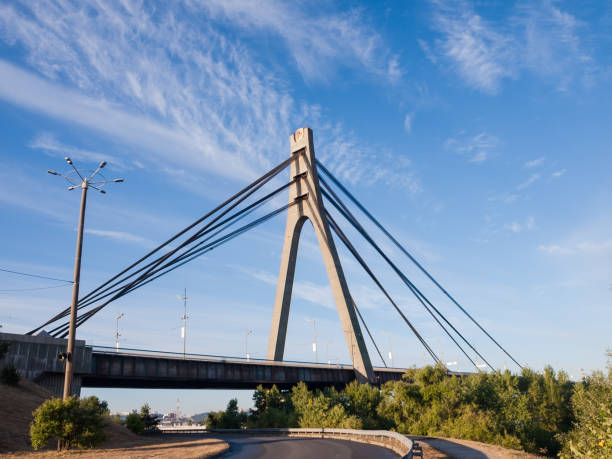 istock Cable-stayed bridge with pylon and steel ropes against sky 1251268306