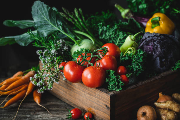 Wooden box full of homegrown produce Top view of fresh organic vegetables in a wooden box. Box full of homegrown produce. freshness stock pictures, royalty-free photos & images