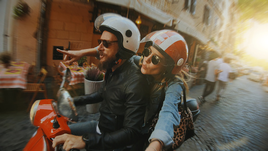 Selfie scooter riding: on the motorbike in the center of Rome