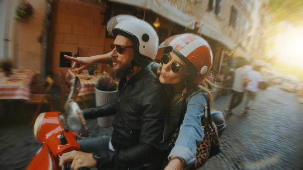 Selfie scooter riding: on the motorbike in the center of Rome Selfie scooter riding: on the motorbike in the center of Rome motor scooter stock pictures, royalty-free photos & images