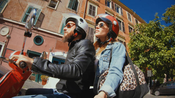 Selfie scooter riding: on the motorbike in the center of Rome Selfie scooter riding: on the motorbike in the center of Rome rent a bike stock pictures, royalty-free photos & images