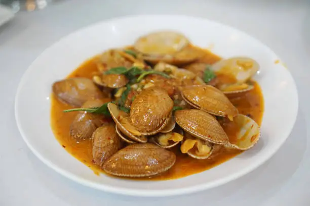 Photo of Stir-fried clams with roasted chili paste, Traditional Thai food recipe.