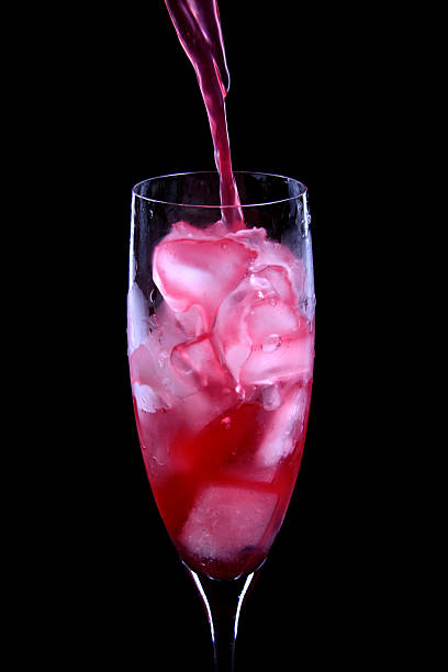istock red cocktail being poured into a glass 125127220