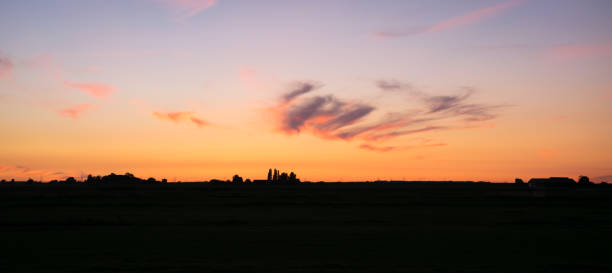 istock Panoramic view of colorful sky over dutch plain 1251272605