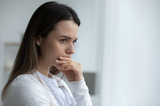 Woman looking in distance feels upset having life troubles Close up image young woman looking in distance feeling sad and lost upset having personal life troubles. Cheated wife break up divorce family split, unwilling pregnancy abortion hard decision concept pessimism photos stock pictures, royalty-free photos & images