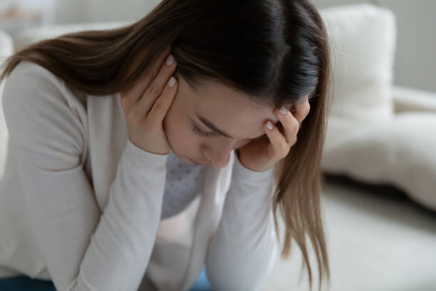 istock Woman sit on couch having mental personal problems feels desperate 1251273854