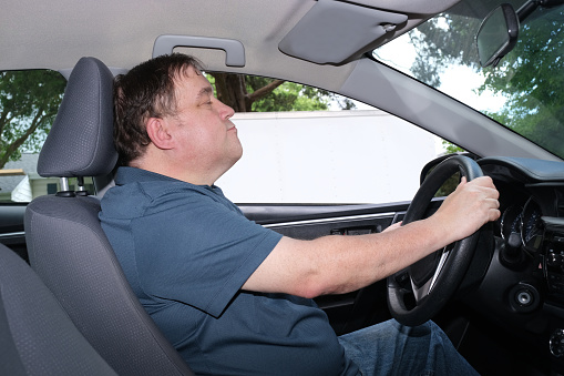 A autistic man behind the wheel of a motor vehicle, and yes he is able to drive