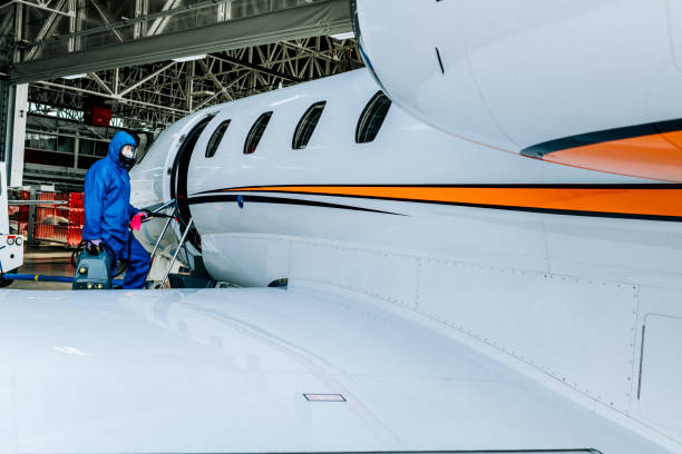 istock A person in protective work suit boarding the private jet parked in a hangar during COVID-19 pandemic 1251275556