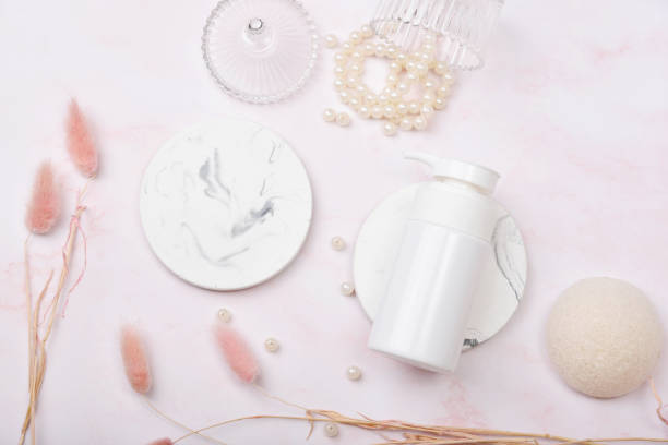 istock Cosmetic bottle containers on pink marble background, Blank label package for branding mock-up, Natural organic beauty product concept, Research and development of purified skincare. 1251275902