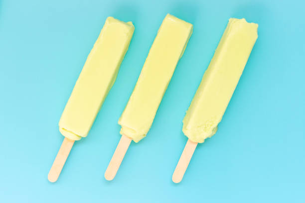 istock Three slices of green ice cream on a blue background 1251276771