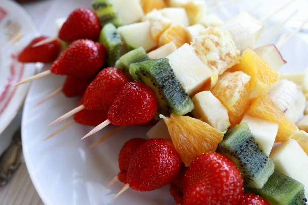 istock Fruits and berries on wooden sticks 1251277373