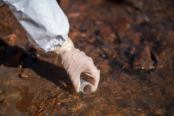 istock Scientist or biologist wearing protective uniforms working together on water analysis. 1251278868