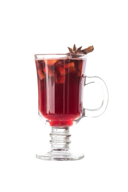 Hot red mulled wine isolated on white background with christmas spices, orange slice, anise and cinnamon stick
