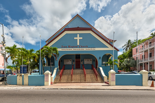 Nassau, Bahamas - May 3, 2019: Street view of Nassau at day with Zion Baptist Chuch on the Shirley Street. Zion Baptist Church was opened for public worship in 1835.