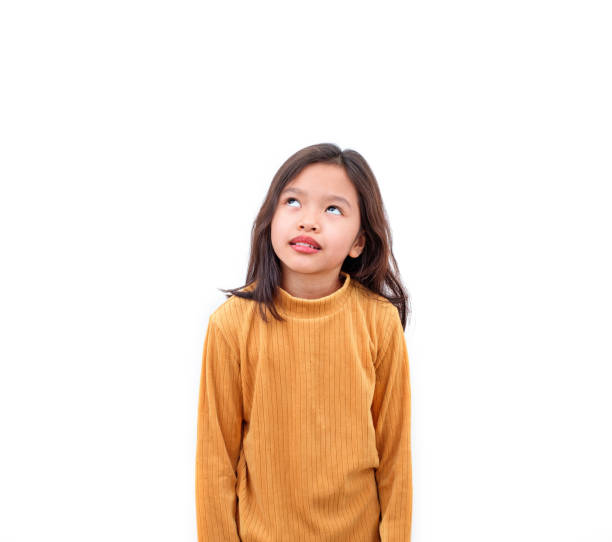 istock asian girl looking up on white background 1251282777