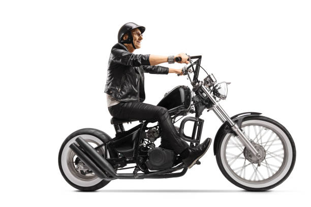 istock Cool elderly biker riding a customized chopper motorbike 1251285831