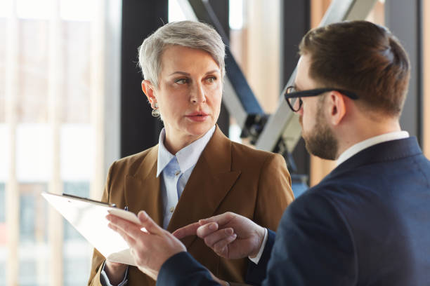 istock Business people discussing the contract 1251285835