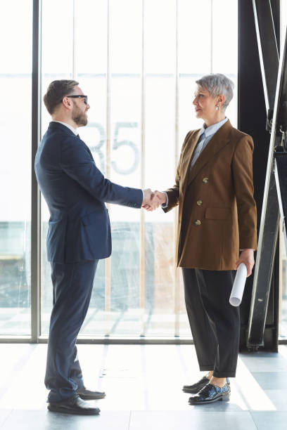 istock Business people shaking hands 1251285842