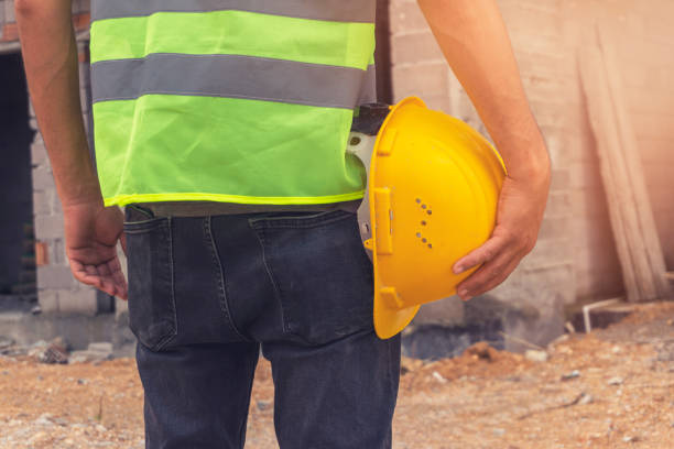istock Worker and the blurred construction in background with space for your text 1251285870