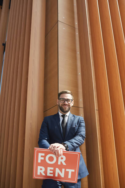 istock Real Estate Agent standing outdoors 1251285926