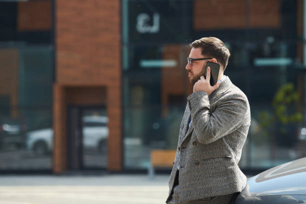 istock Man talking on the phone outdoors 1251286049