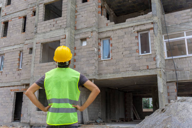 istock A construction engineer, control a pouring concrete pump on construction site and sunset background 1251286757