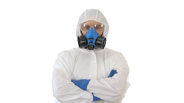 istock Doctor in protective suits with folded hands on white background 1251288974