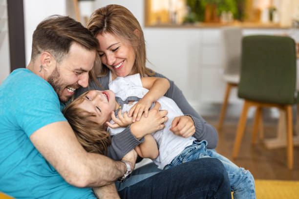 istock Young happy family having fun at home. 1251289537