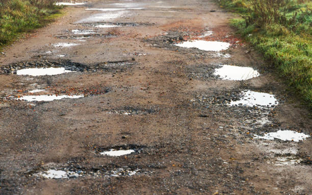 istock Puddles on paved road - Charcos en camino asfaltado 1251291024