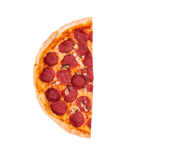 istock Half of salami pizza with mushrooms, isolate top view 1251293472