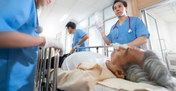 front view of doctors running to the operating room,doctor wheeling patient emergency service hospital background - surgeon urgency expertise emergency services imagens e fotografias de stock