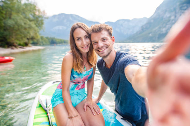 couple taking selfie on vacation in triglav national park - sport exercising men julian alps imagens e fotografias de stock