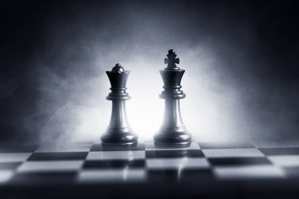 istock Black king and queen on chess board 1251299349
