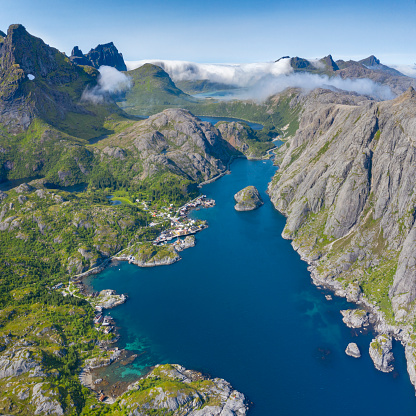 Aerial panorama of the tranquil fishing village Nusfjord, Lofoten, Norway. It is the islands' most well-preserved fishing village and famous for its Rorbuer, little cabins. Converted from RAW.
