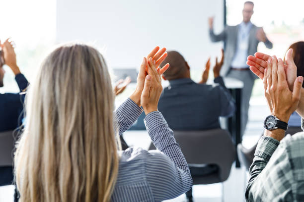 istock Applauding on successful business presentation! 1251299724